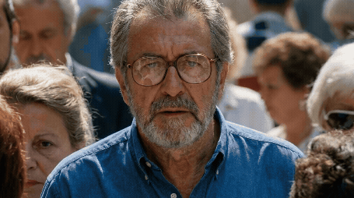 Handheld camera with man in crowd