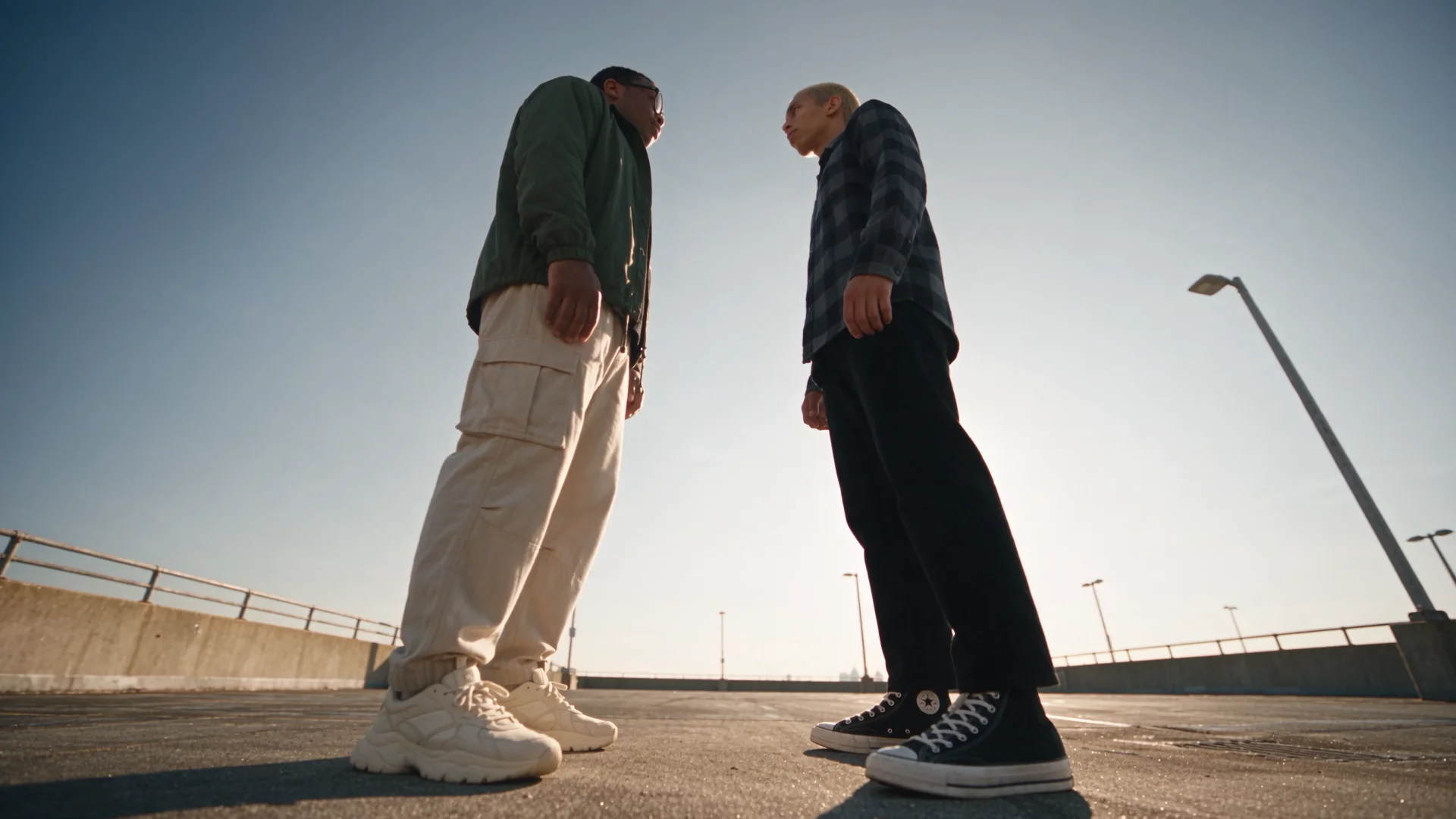 Low angle shot looking up at the two men squaring off
